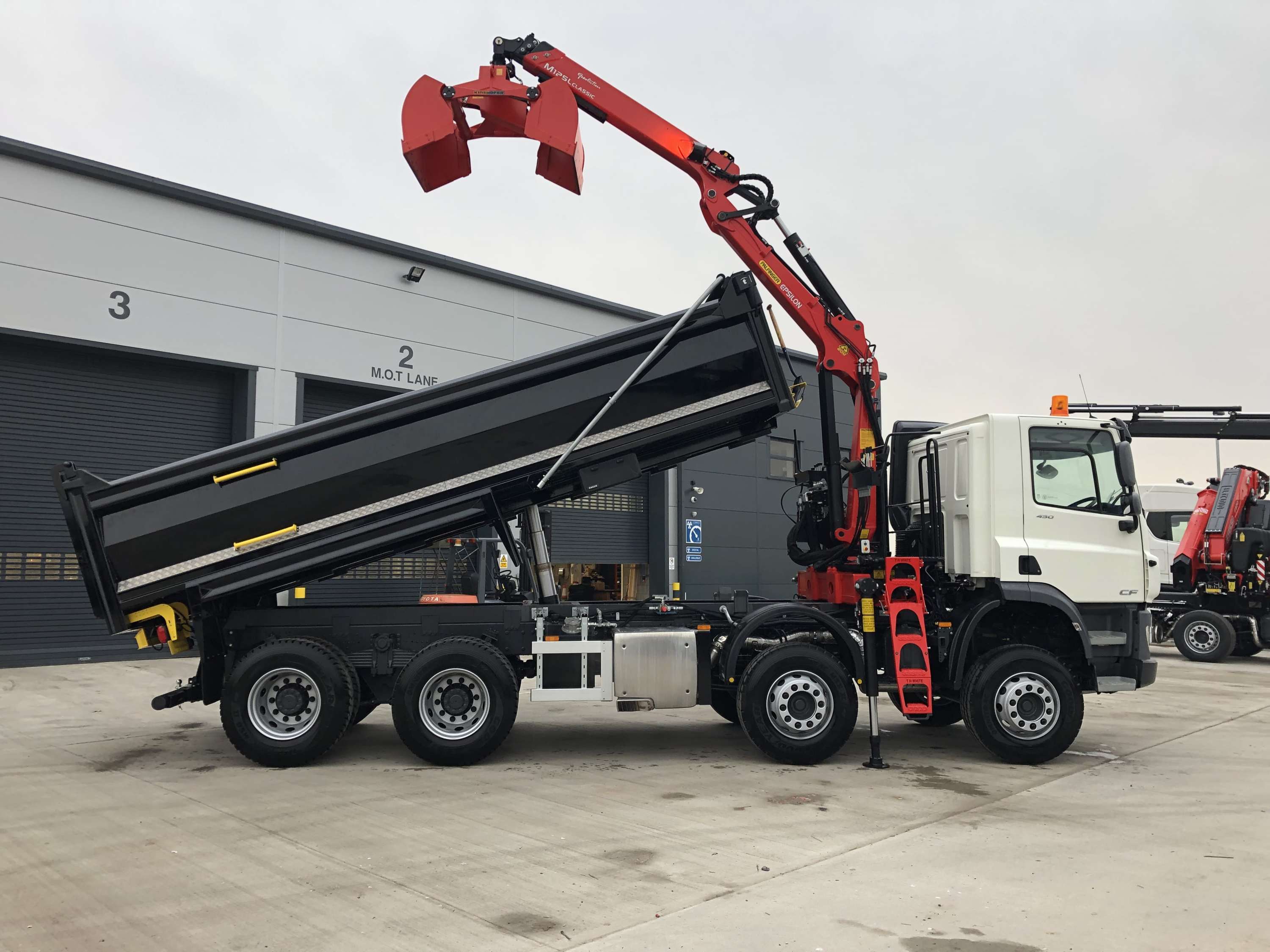 Black Tipper lorry with back up